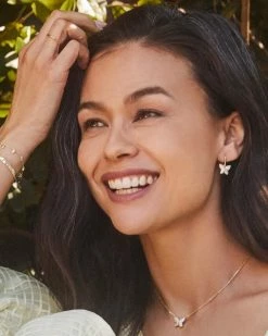 Kendra Scott Lillia Crystal Butterfly Gold Drop Earrings In White Crystal -Demi-Fine Jewelry Shop Kendra Scott Lillia Butterfly Huggie Earring White Crystal Gold 01